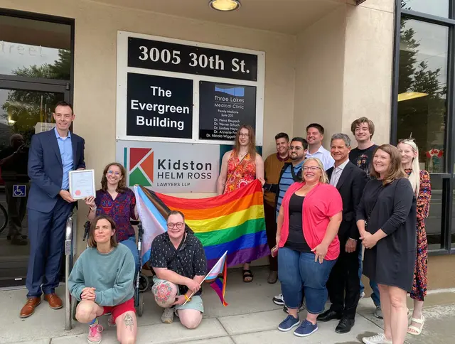 Staff and the Vernon Pride Society outside the office