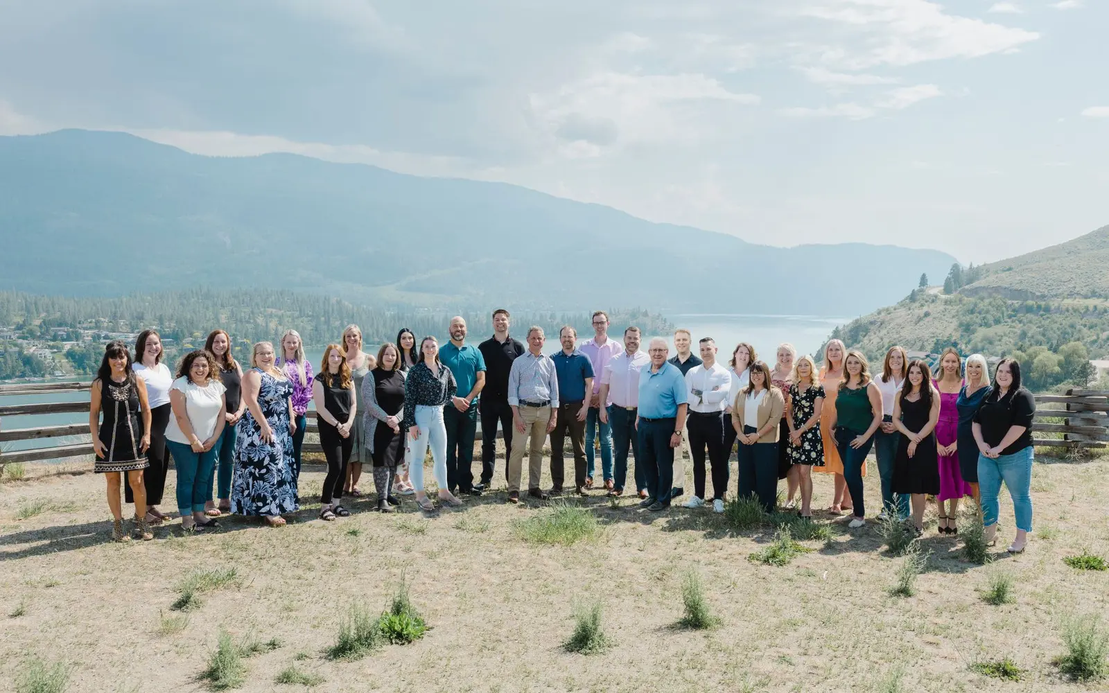 The firm's staff outdoors above Kalamalka Lake